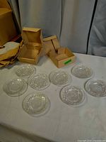 Full lot showing eight plates and two original cardboard boxes