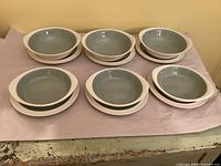 Full lot: stacked lugged bowls and underplates