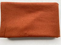 Folded dark cinnamon wool fabric length