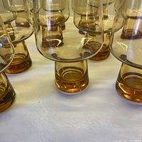 close view of bases showing thick amber glass