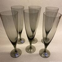 Full set of six smokey grey champagne flutes front view