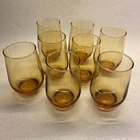 Full set of eight amber tumblers front view
