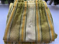 Stacked folded panels showing stripe colours and texture