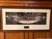 Full view of framed panoramic photograph on wall