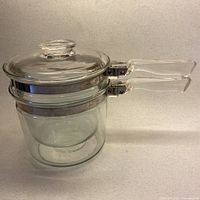 Complete double boiler assembled with lid
