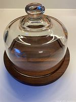 glass dome on teak board