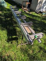 Overall view of aluminum support rail with brackets set on stand legs