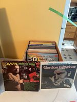 Box of LPs with two records displayed (Roger Whittaker, Gordon Lightfoot)