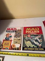 Front covers of MAD Follies No.1 and No.2 side by side showing titles and artwork