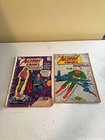 Front covers of both Action Comics issues