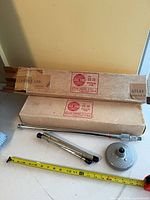 Two boxed Atlas Sound CS-33 stands with components and measuring tape