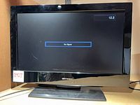 Front view of Emerson 26-inch LCD TV powered on showing No Signal menu