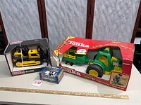 All three boxed toys on table