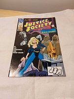 Full front cover of comic showing title, character art, creators' names