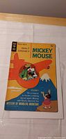 Front cover of 1969 Gold Key Walt Disney Mickey Mouse comic showing red airplane illustration and 15¢ price