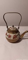 Side view showing overall teapot shape, handle, spout, floral cloisonné band