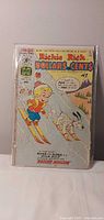 Front view of Richie Rich Dollars & Cents comic issue 78 in plastic bag