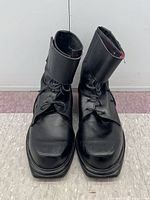 front view showing both boots, toe scuffs