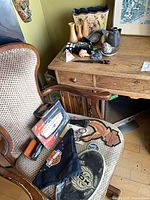 Group shot showing Harley items on chair and vases, stones, basket on desk