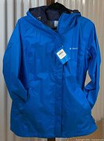 Front view of blue Columbia hooded jacket with tags