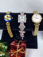 Three watches on display: Stanton left, Croton center, Fossil right