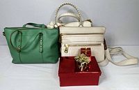 Group shot of all three Fossil handbags showing colors, sizes and overall condition