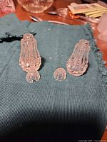 pair of shakers with one top removed showing chip