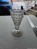 front view of clear pressed glass lattice bud vase