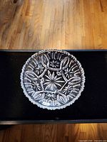 Top view showing starburst and floral pressed pattern and scalloped rim
