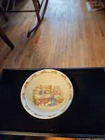 Top view of Bunnykins cereal bowl showing interior scene and rim border