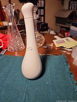 Full view of white Royal Doulton cruet with stopper inserted