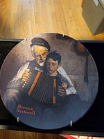 Front view of decorative plate showing Rockwell artwork