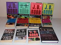 All twelve J.D. Robb In Death books laid out in three rows
