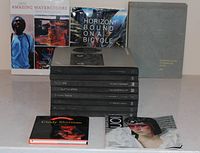 Group shot showing all books upright and stacked