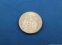 Reverse side of 1963 Canadian 50¢ coin showing coat of arms