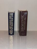 Front spines of both hardcovers standing upright