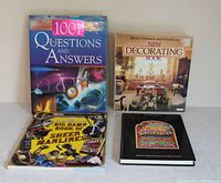 All four books front covers visible