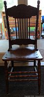 Full front view of antique wooden chair