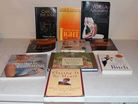 All nine books arranged on table, titles facing forward