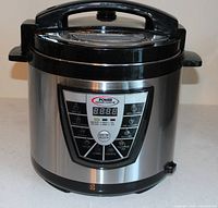 Front view of stainless Power Pressure Cooker XL showing digital control panel