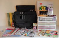 Full lot overview showing tote, storage drawers, scissors carousel, papers, stickers, magazines