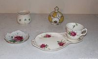 Full lot showing tea cup, saucer, snack tray, Irish bowl and lidded powder bowl