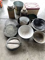 all metal containers laid out on floor