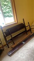 Headboard, footboard, side rails, slats against wall