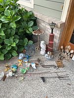 Group view of all yard art items on ground