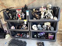 Six Husky bins stacked three over three filled with miscellaneous items