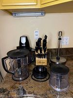 Full view of Ninja system components, Wüsthof knife block with knives, and paper towel holder on countertop