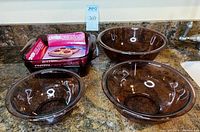 All five Pyrex cranberry glass pieces grouped