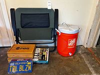 Lot overview folded chair, cooler, boxes, screen door, licence plates