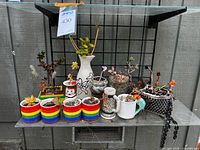 Full view of all planters and succulents on shelf